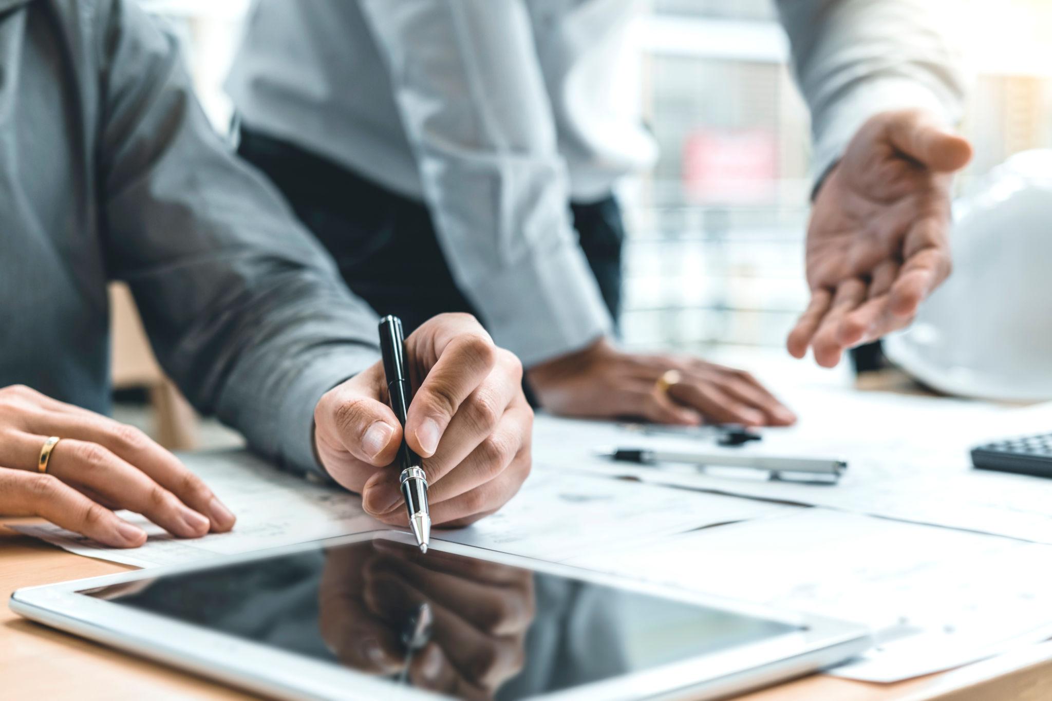 PrimeCore team reviewing project documents